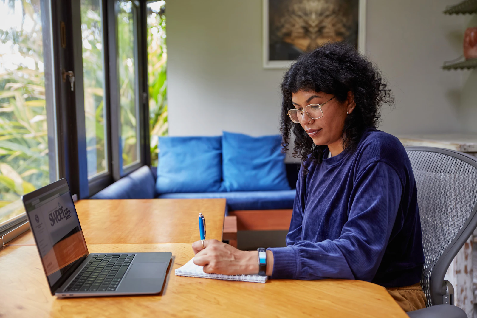 Young woman working on a laptop at home